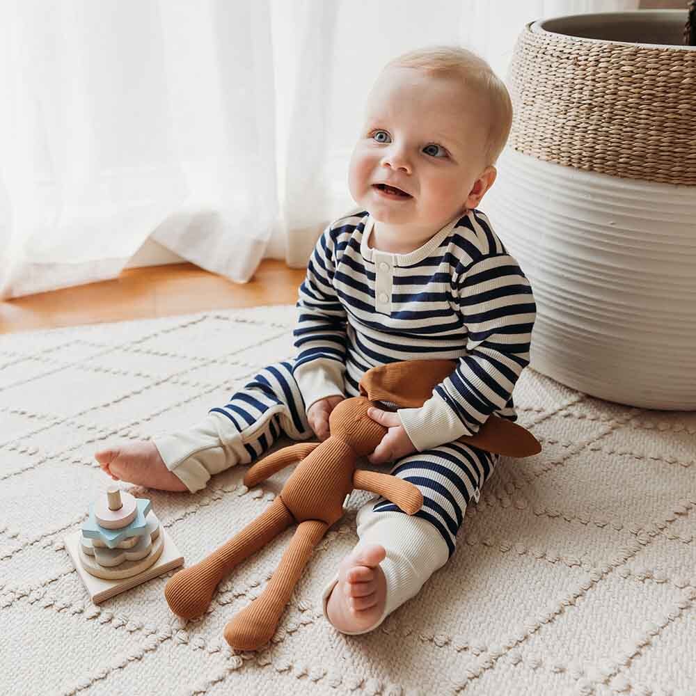 Toddler wearing the Moonlight Stripe Organic Growsuit by Snuggle Hunny