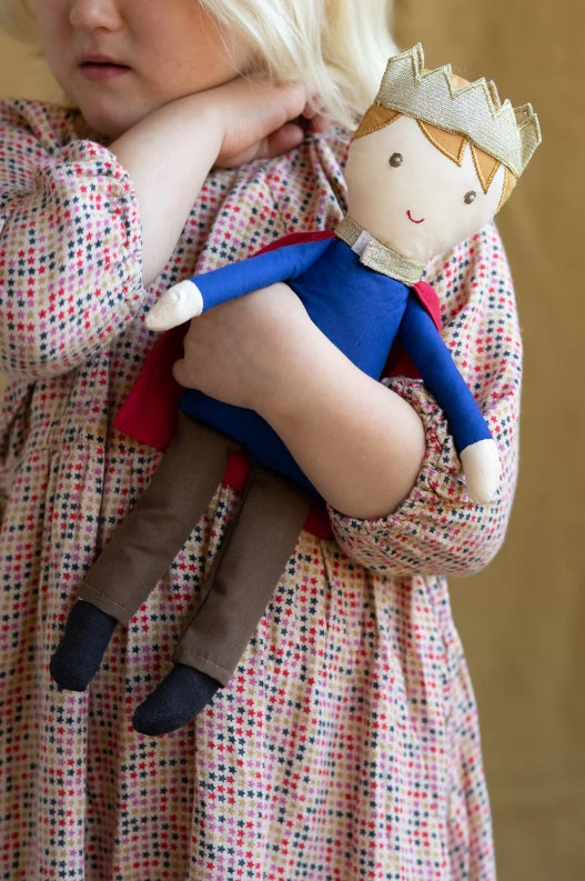 Girl holding the Prince Harry Doll by Nana Huchy