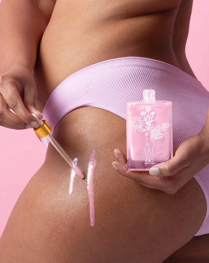 Person using the BOPO Women Summer Solstice Body Oil Ltd Edition