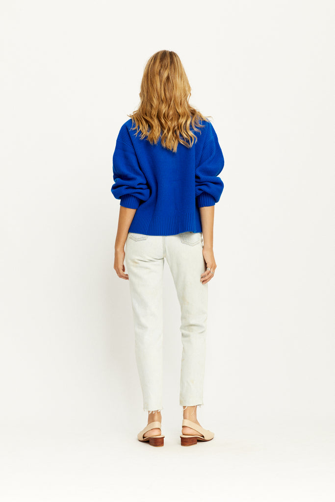 Model showing the back of the Alanis Knit Jumper in Cobalt by Arnhem Clothing