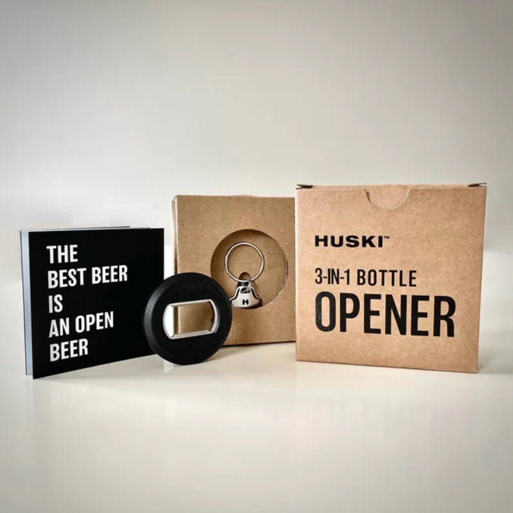 Styled picture of the 3-in-1 Bottle Opener Keyring by Huski