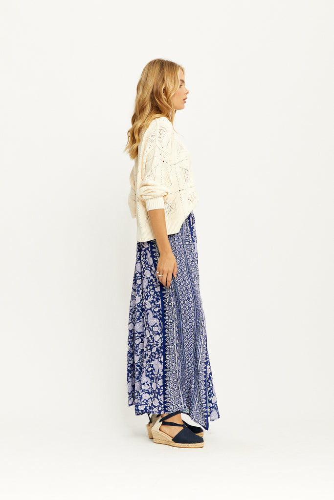 Model showing the side of the Angelis Maxi Skirt in Sapphire by Arnhem Clothing