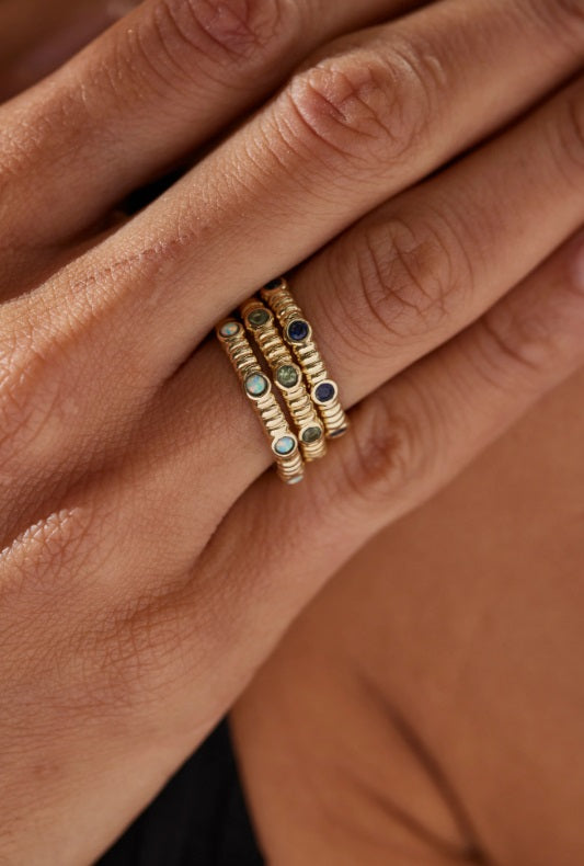Person wearing the Toni May Asymmetric Sapphire Gold Stacker 