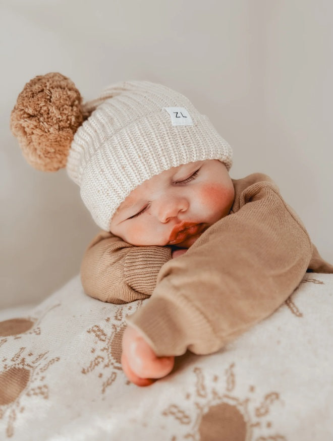 Baby wearing the Beanie Biscotti Fleck by Ziggy Lou