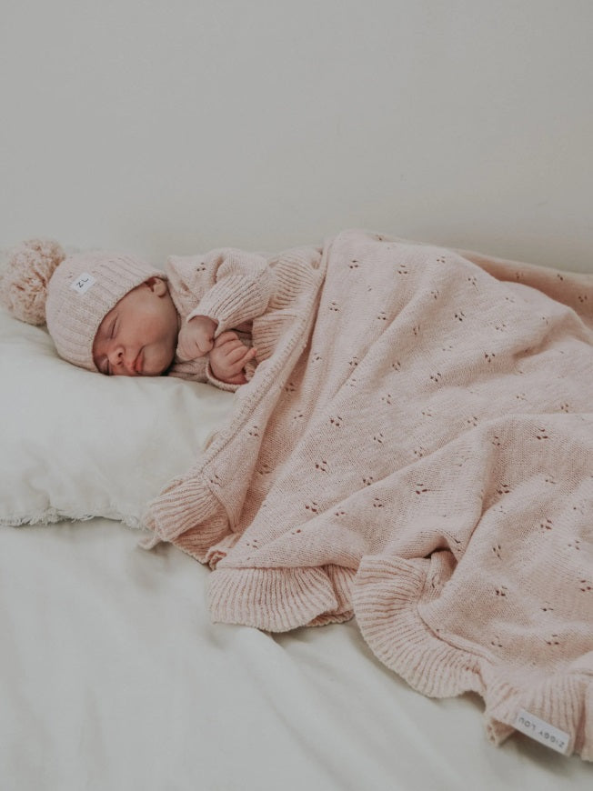 Baby asleep using the Blanket Petal Frill by Ziggy Lou