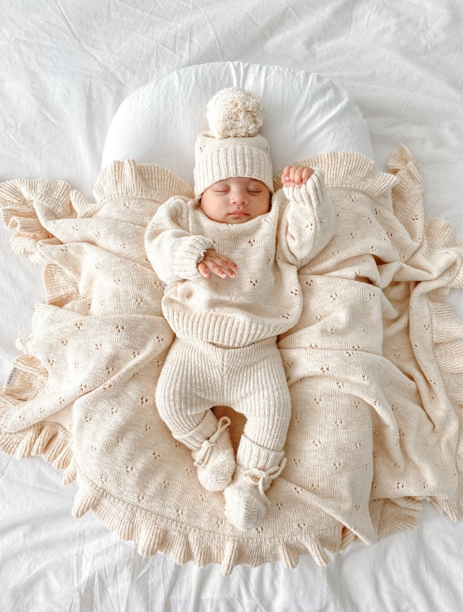 Baby asleep using the Blanket Petal Frill by Ziggy Lou