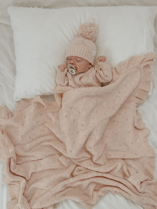 Baby asleep with the Blanket Petal Frill by Ziggy Lou