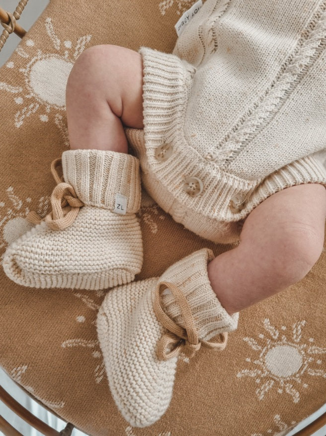 Baby wearing the Booties Biscotti Fleck by Ziggy Lou