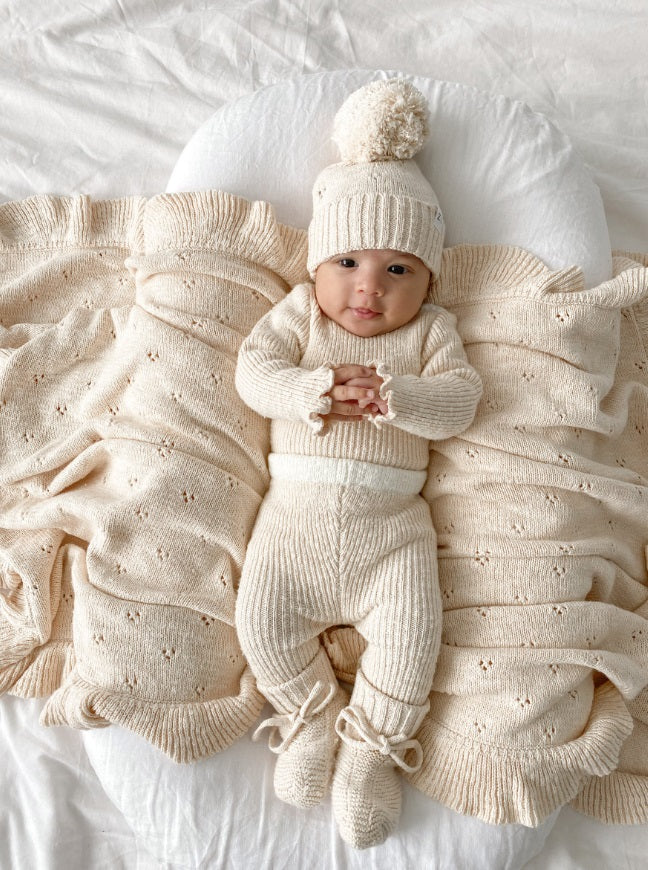 Baby wearing the Booties Petal by Ziggy Lou