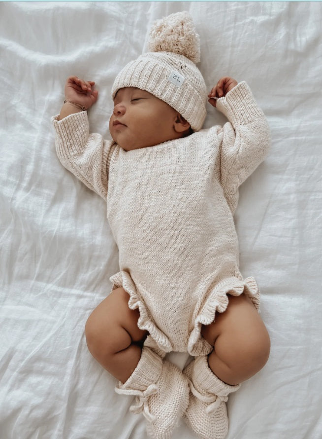 Baby wearing the Booties Petal by Ziggy Lou