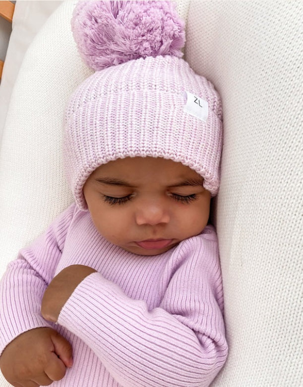 Baby asleep wearing the Beanie Lavender by Ziggy Lou