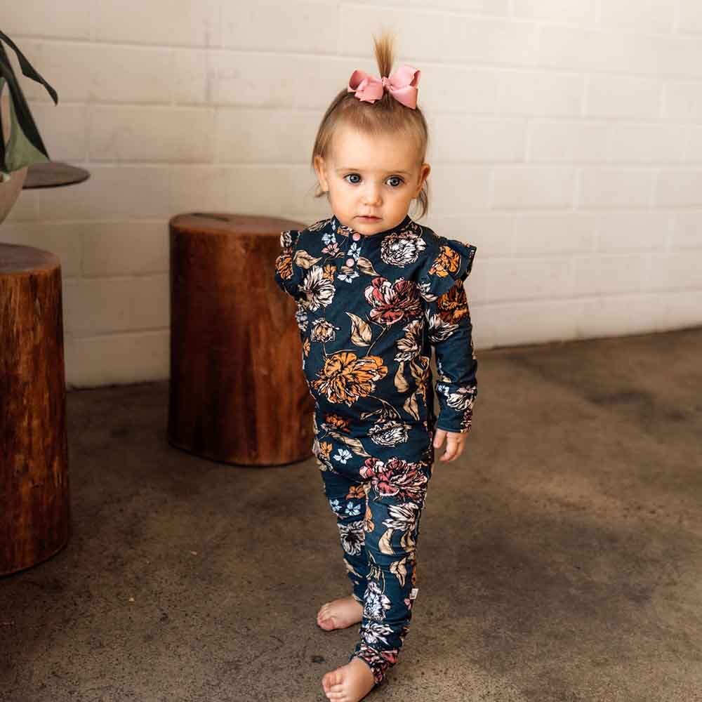 Toddler wearing the Belle Organic Growsuit by Snuggle Hunny