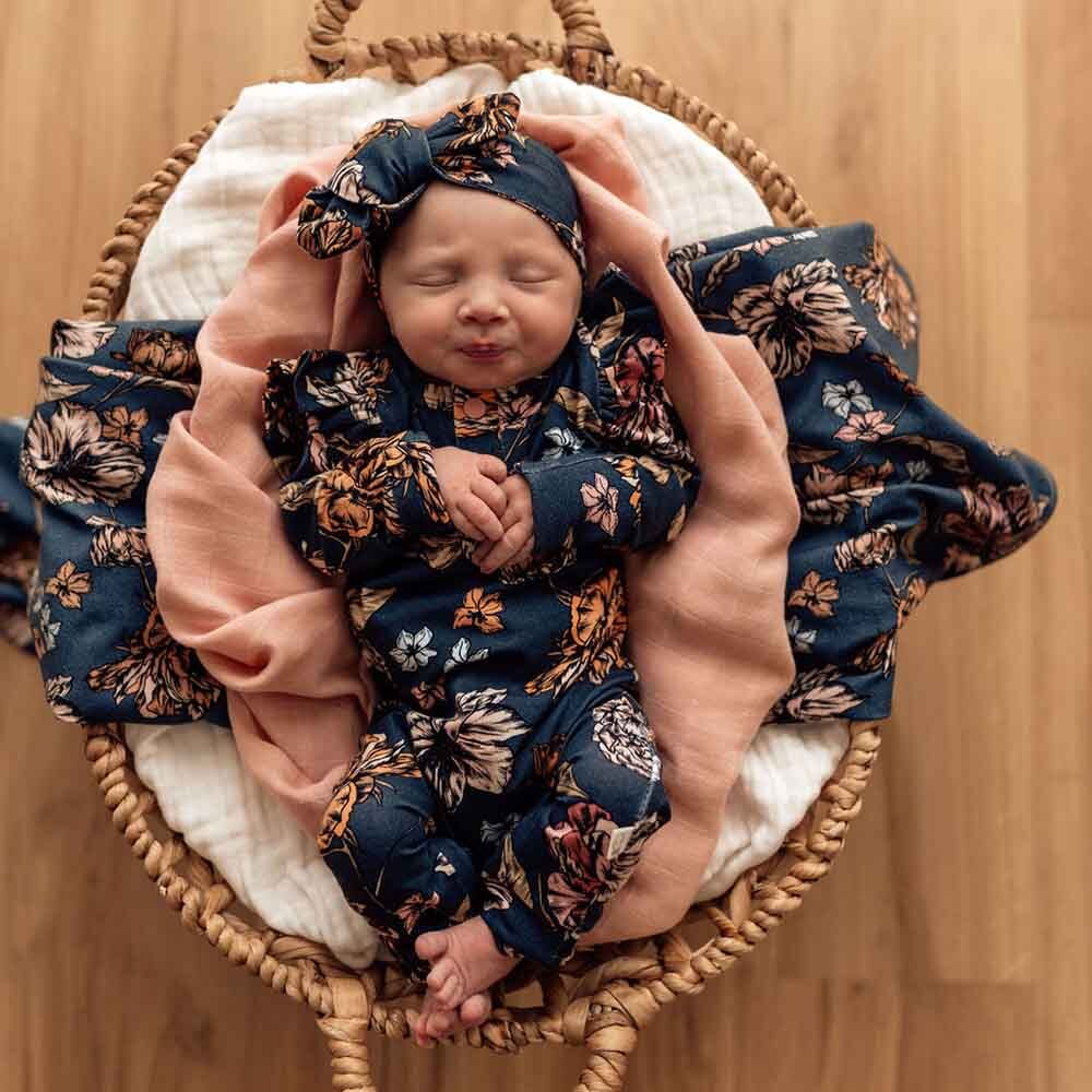 Baby wearing the Belle Organic Growsuit by Snuggle Hunny