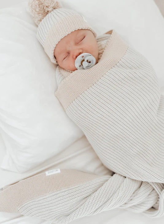 Baby sleeping wrapped in the Blanket Coast by Ziggy Lou