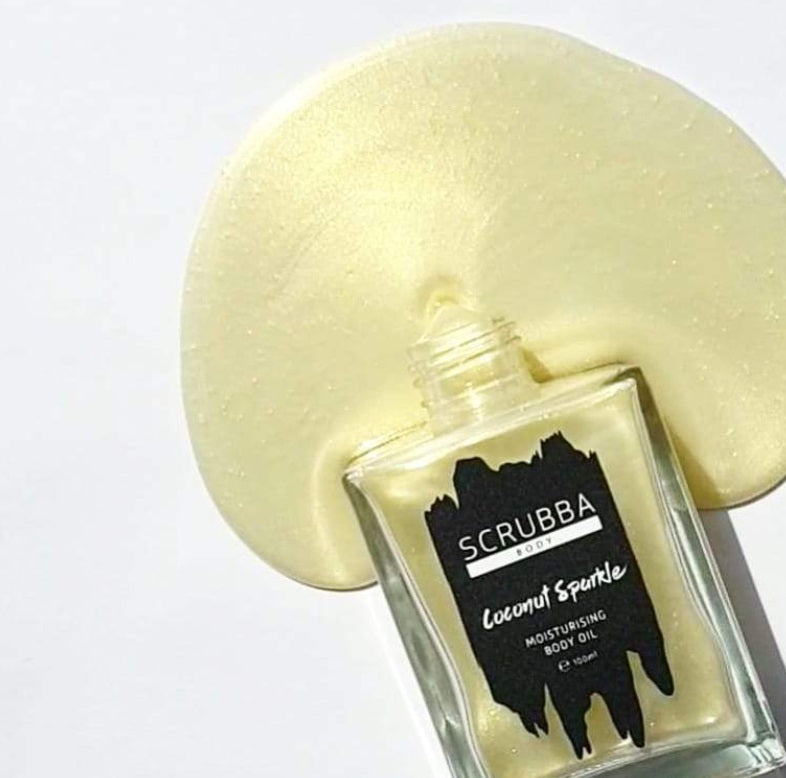 Flatlay of the Coconut Sparkle Body Oil by Scrubba Body