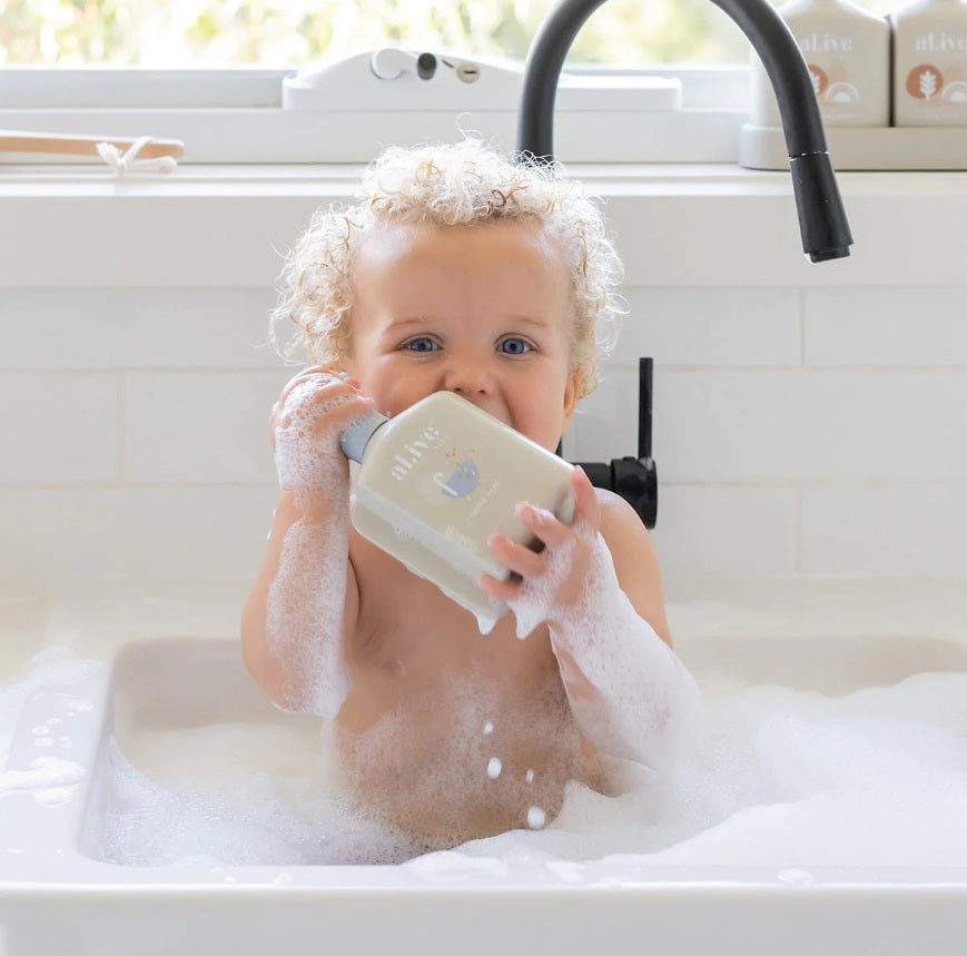 Baby in bath using the Alive BABY BUBBLE BATH - APPLE BLOSSOM