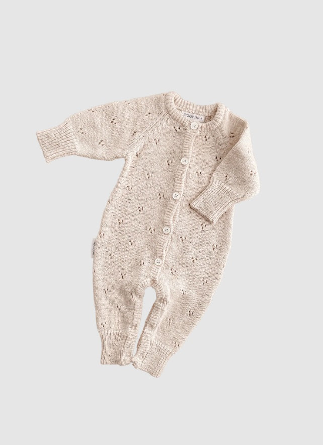 Flat lay of the Classic Knit Romper Petal by Ziggy Lou