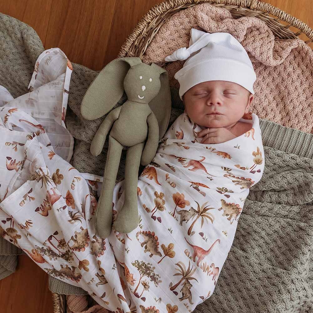 Baby Asleep in the Dino Organic Muslin Wrap by Snuggle Hunny