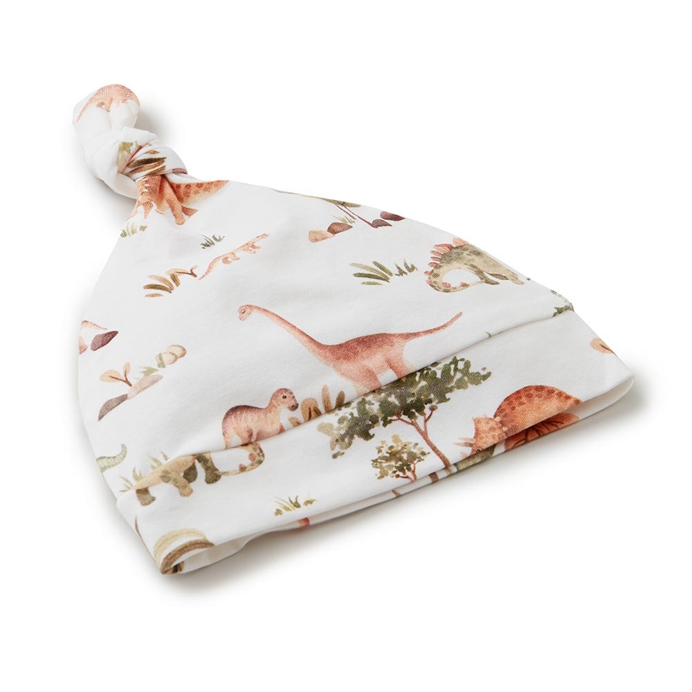 Flatlay of the Dino Organic Knotted Beanie by Snuggle Hunny