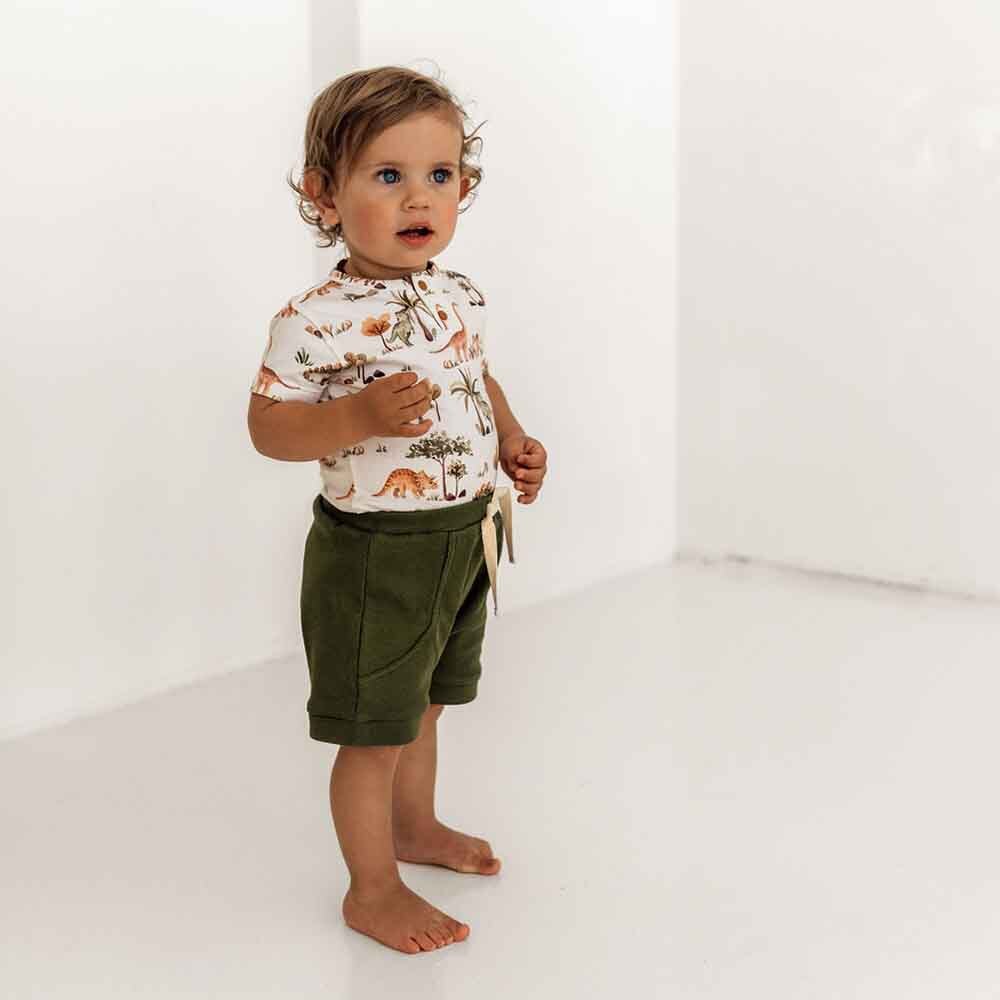 Toddler wearing the Dino Short Sleeve Organic Bodysuit back by Snuggle Hunny