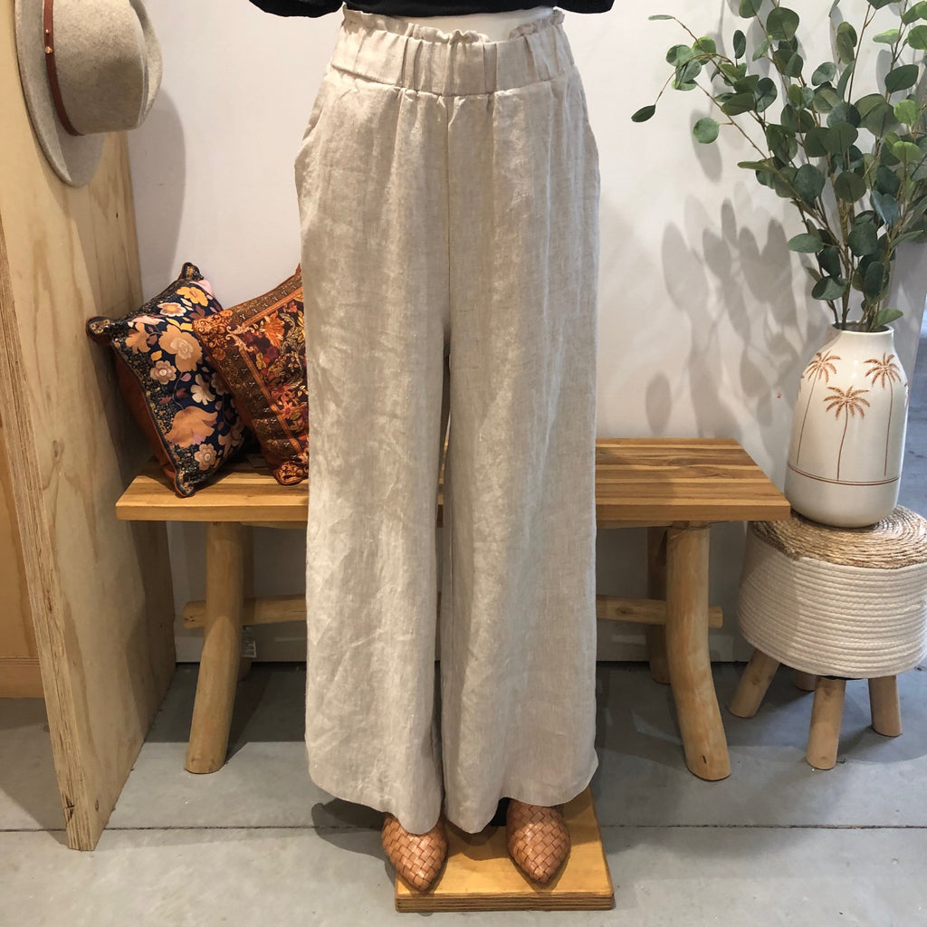 Model wearing the Natural Freya Linen Pants by Little Lies