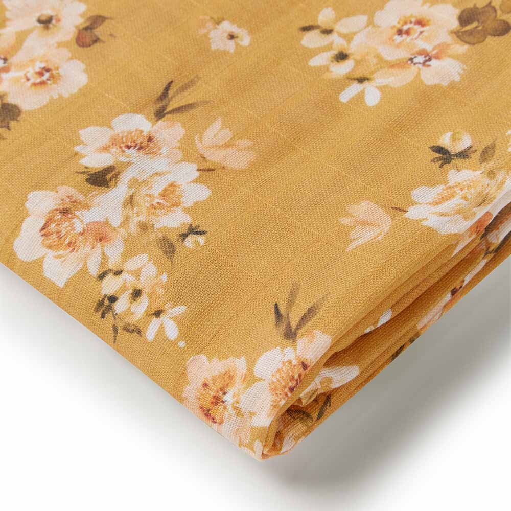 Close up of the Golden Flower Organic Muslin Wrap by Snuggle Hunny