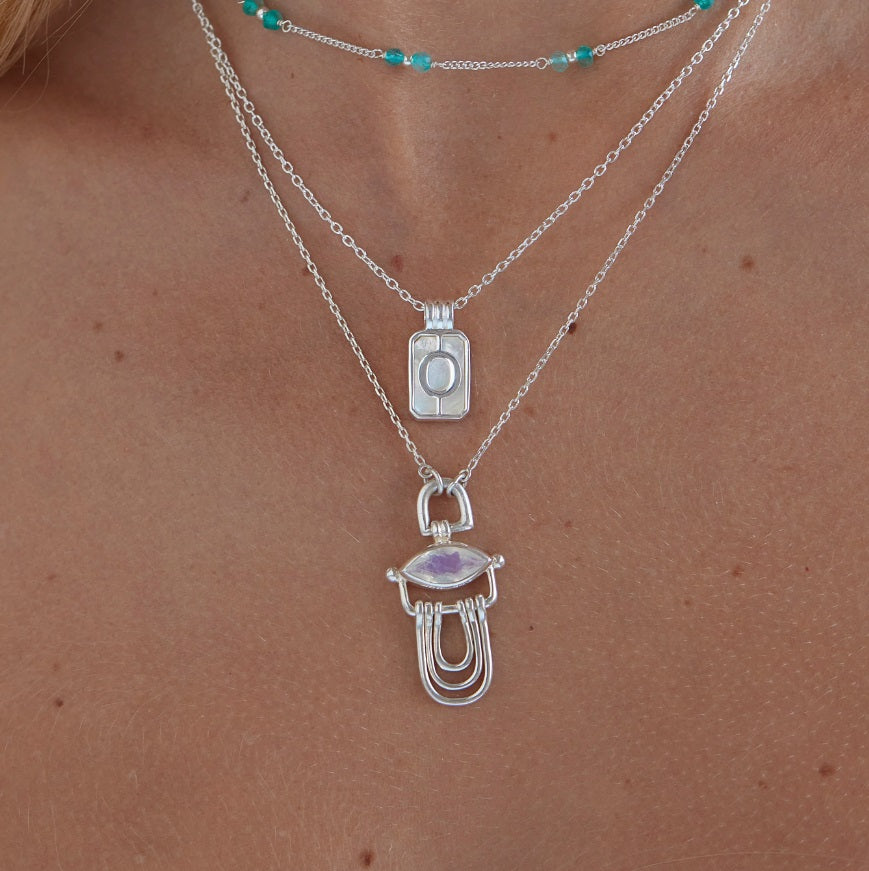 Model showing the size of the Toni May Initial A To Z Silver Pendant