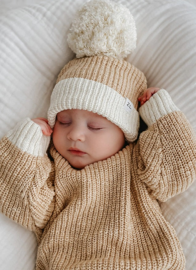 Baby wearing the Jumper Two Tone Wheat by Ziggy Lou