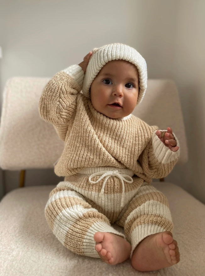 Baby wearing the Jumper Two Tone Wheat by Ziggy Lou