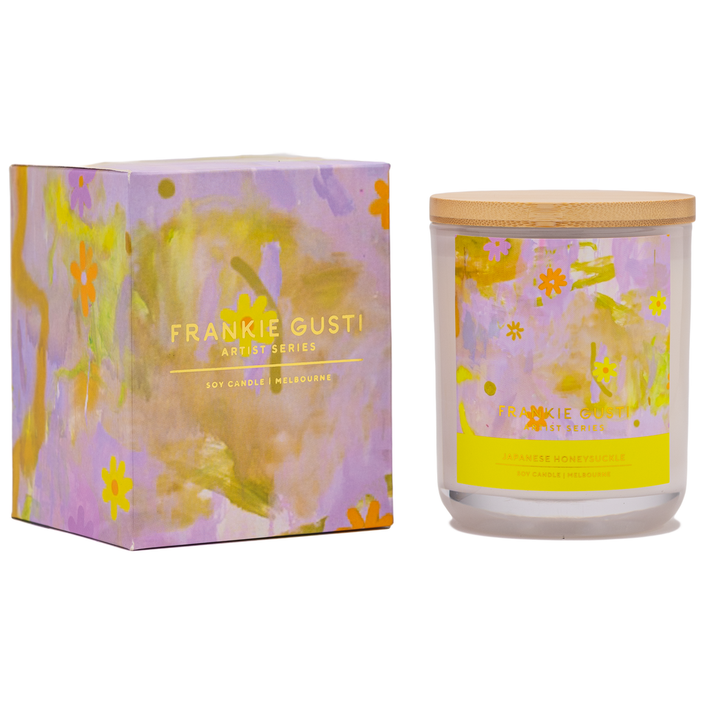 Box and candle side by side of the Frankie Gusti - Artist Series Candle - JAPANESE HONEYSUCKLE