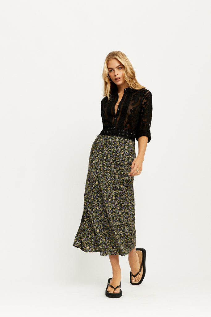 Model wearing the Joni Midi Skirt in Moonless by Arnhem Clothing