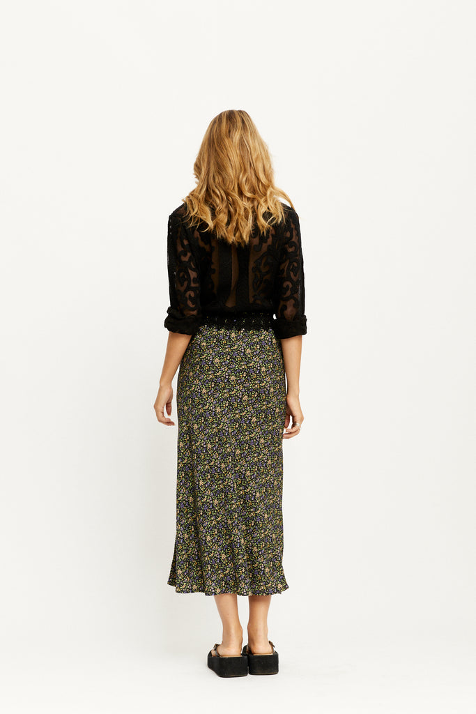 Model wearing the Joni Midi Skirt in Moonless by Arnhem Clothing