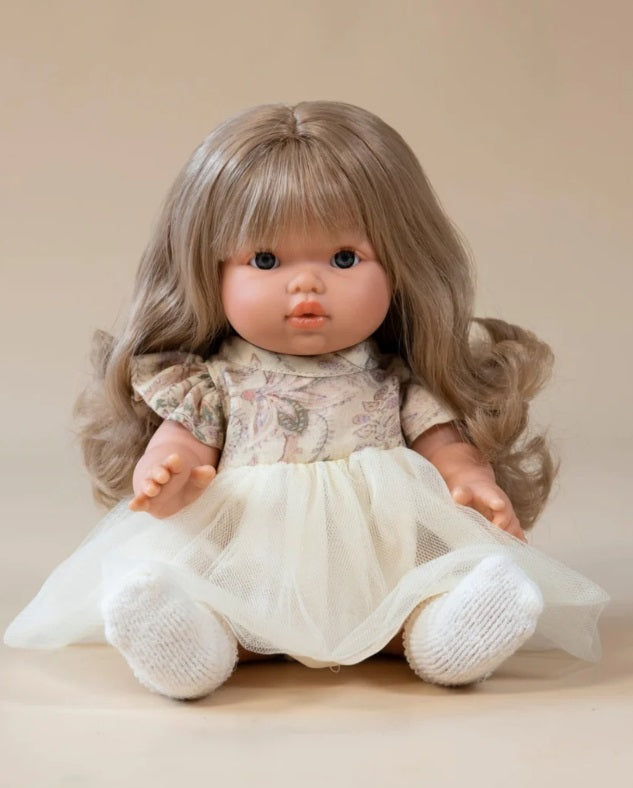 Lyla Doll by Mini Colettos sitting in dress