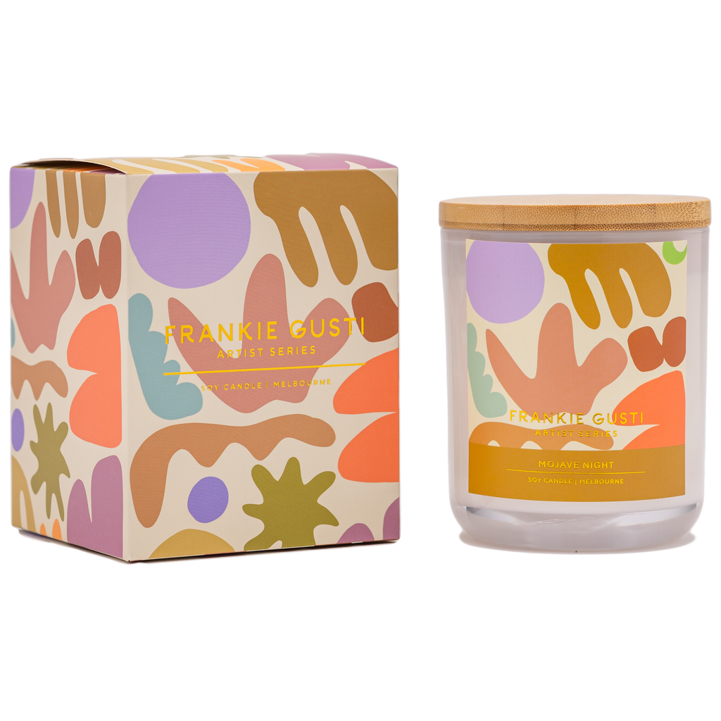 Box and candle side by side of the Frankie Gusti - Artist Series Candle - MOJAVE NIGHT
