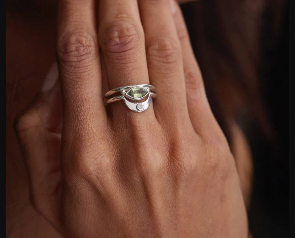 Hand showing off the Toni May Nyra Marquise Apatite Silver Stacker