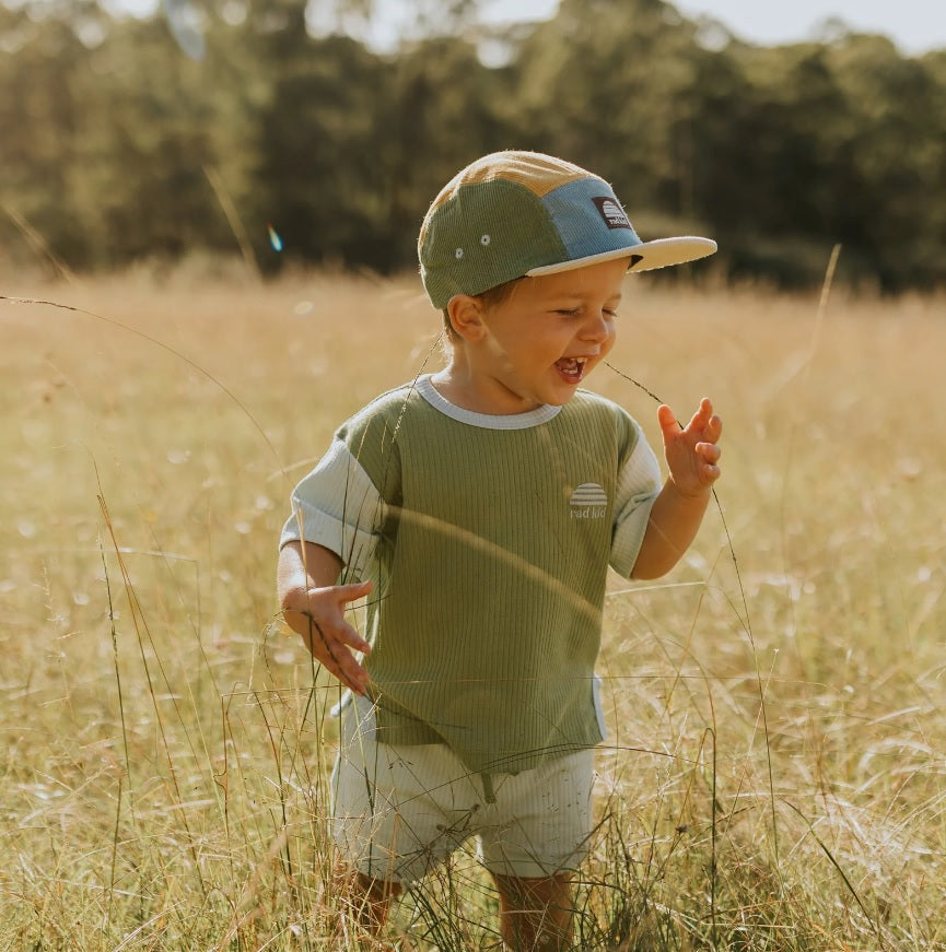 Toddler wearing the Rad Kid Spliced Cord 5 Panel Cap - Brights