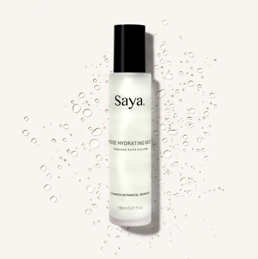 The front of the Rose Hydrating Mist by Saya Skin surrounded by water droplets