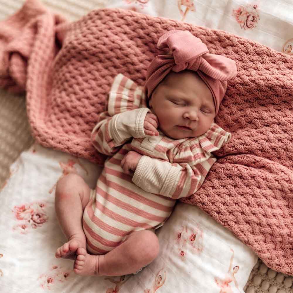 Newborn wearing the Rose Stripe Long Sleeve Bodysuit by Snuggle Hunny