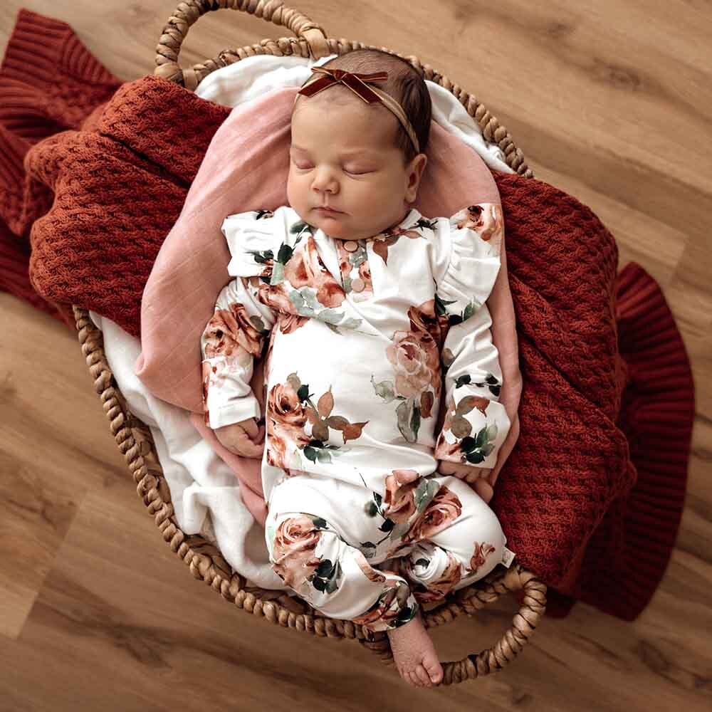 Baby asleep wearing Rosebud Growsuit by Snuggle Hunny