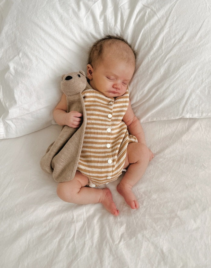 Baby asleep wearing the Summer Bubble Romper Golden Stripes by Ziggy Lou
