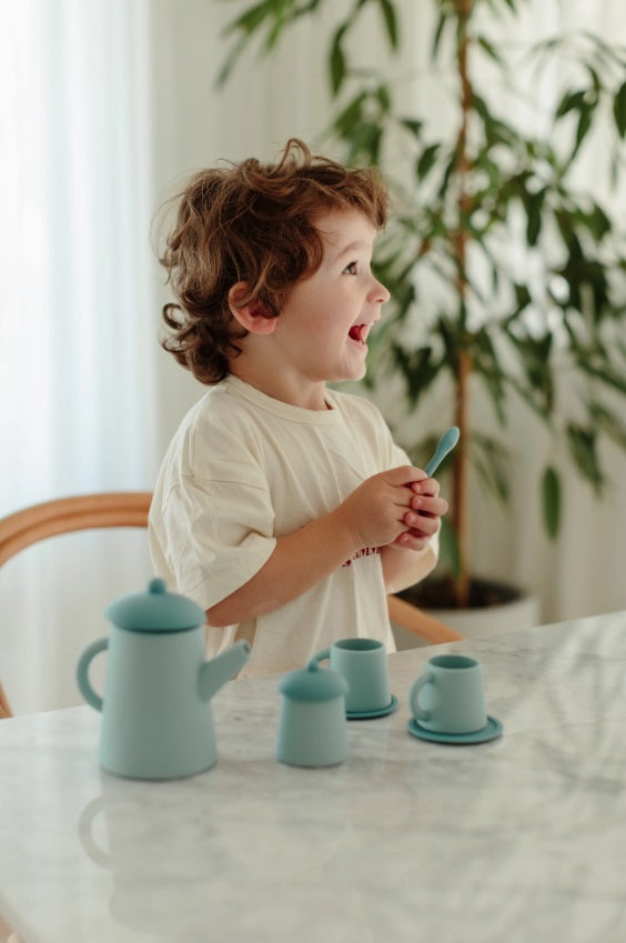 Child playing with the Blue Tea Time Set by Little Drop