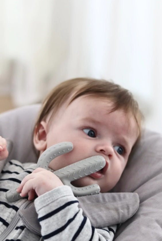 Baby using the Cactus Teether by Little Drop