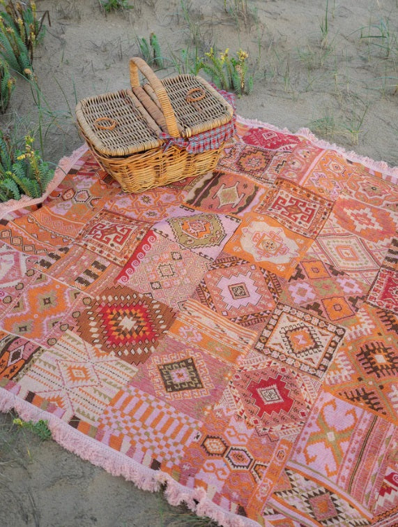 The Patchwork Rug by Salty Aura being used at the beach