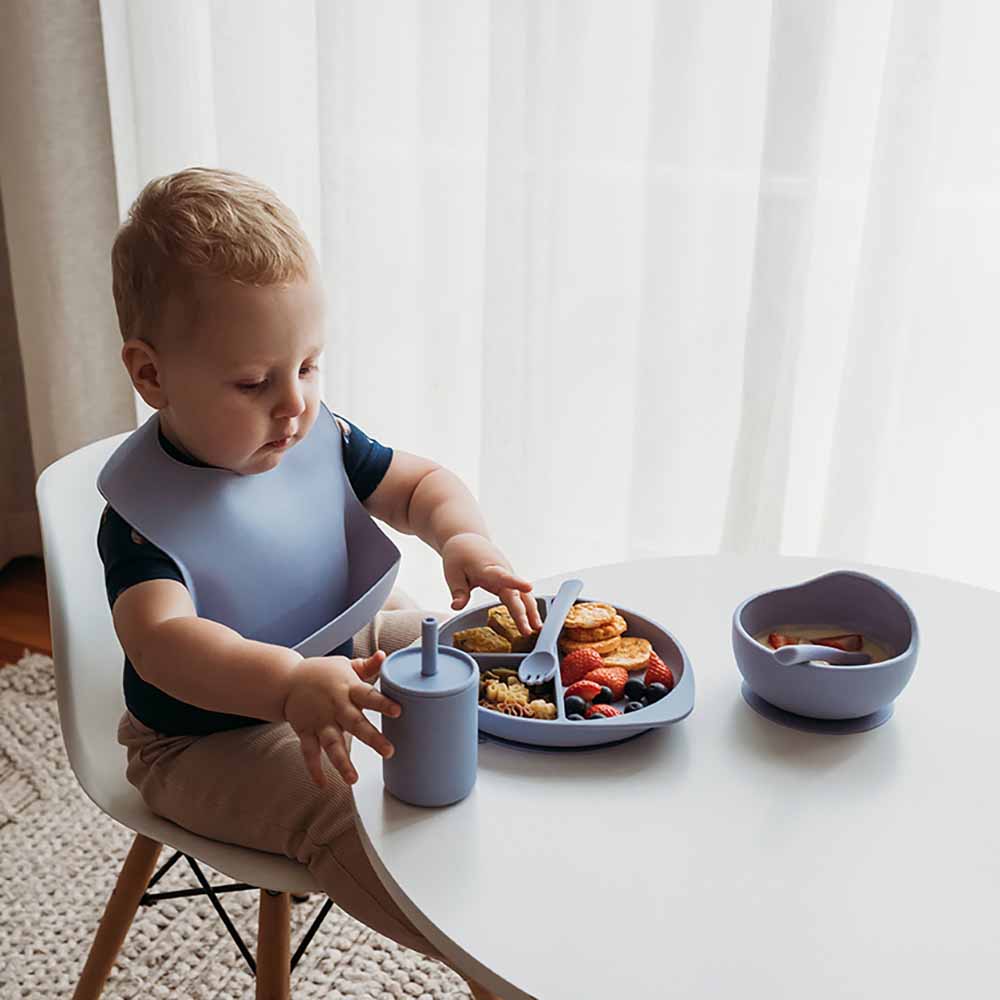 Toddler using the Silicone Sippy Cup Zen by Snuggle Hunny