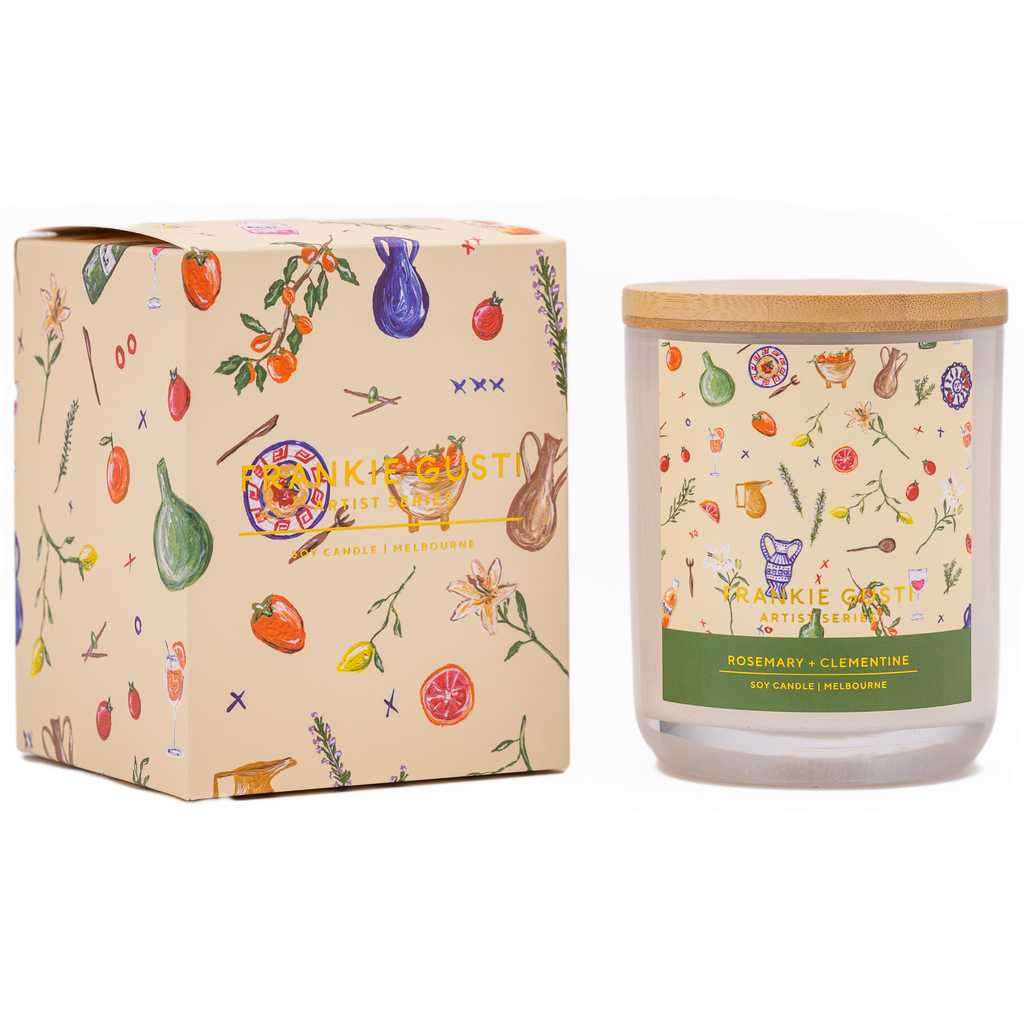 Box and candle side by side of the Frankie Gusti - Artist Series Candle - ROSEMARY + CLEMENTINE