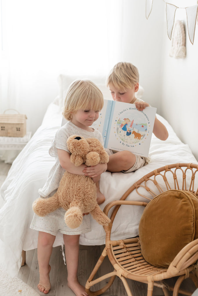 Kids reading the Charlie's Mindful Adventures by the Sea by Mindful & Co