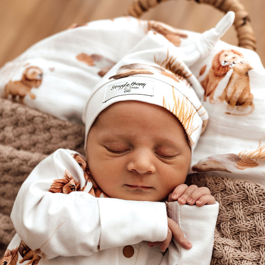 Baby Sleeping wearing the Lion Organic Knotted Beanie by Snuggle Hunny